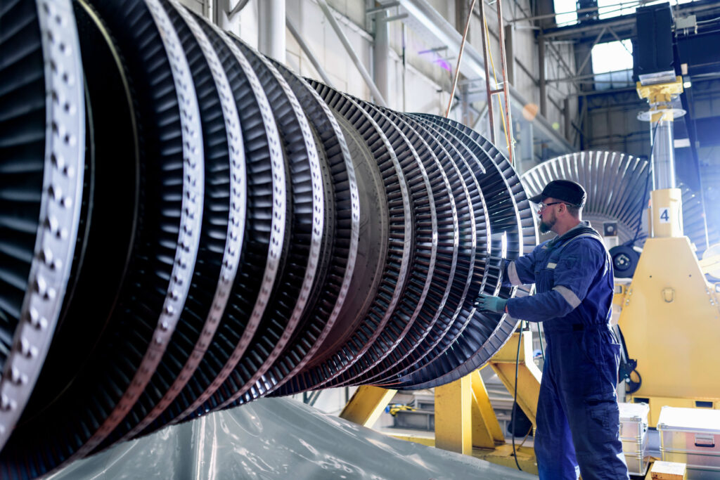 Man working on industrial steam turbine