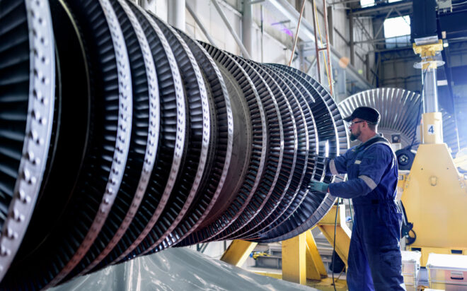 Man working on industrial steam turbine
